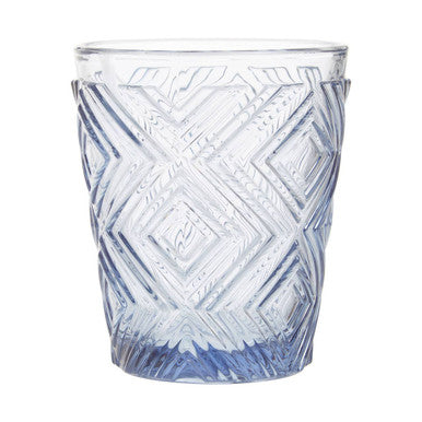 Clear glass tumbler with blue geometric pattern on a white background