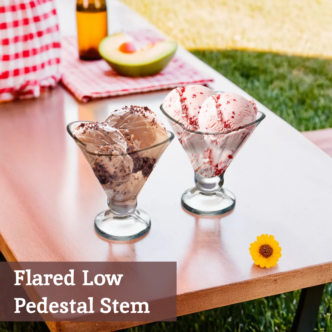 Two glass dessert bowls with ice cream on a table outdoors, with text &