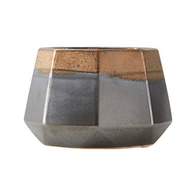 Geometric ceramic planter with brown and gray colors on a white background