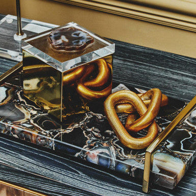 Decorative tray with pretzels on a marble surface