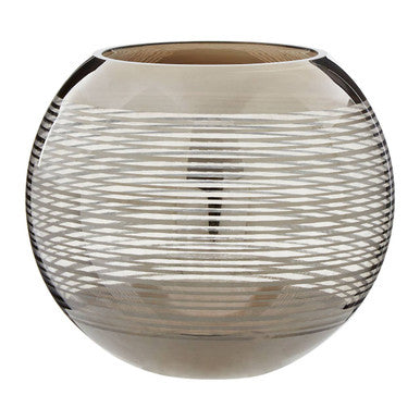 Decorative glass vase with ribbed design on a white background