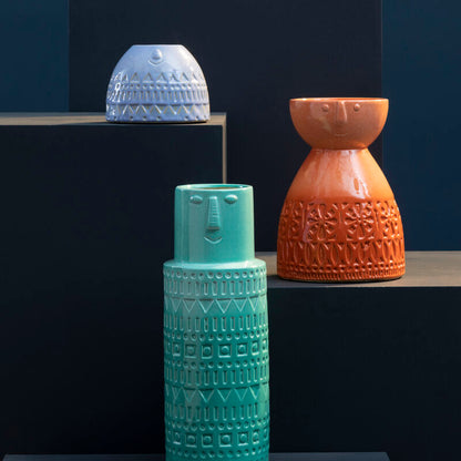 Set of colorful textured vases on a dark background