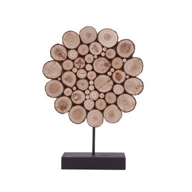 Decorative piece made of stacked wooden logs on a white background