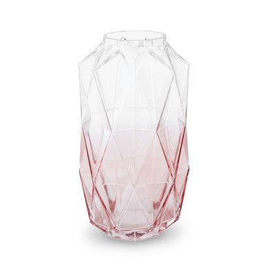 Geometric glass vase with pink gradient on a white background