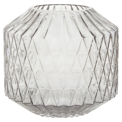 Geometric glass vase with diamond pattern on a white background
