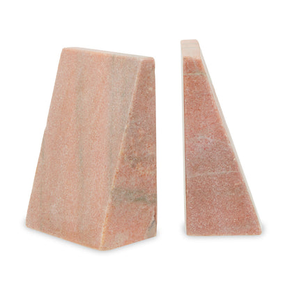 Two triangular pink stone wedges on a white background
