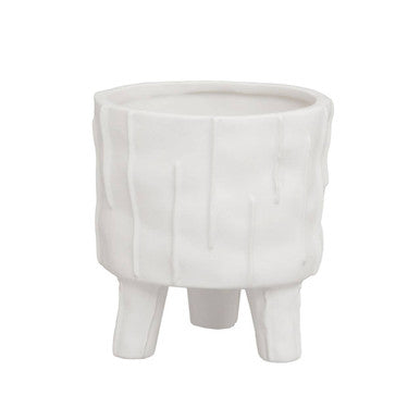 White marble planter with a unique design on a white background