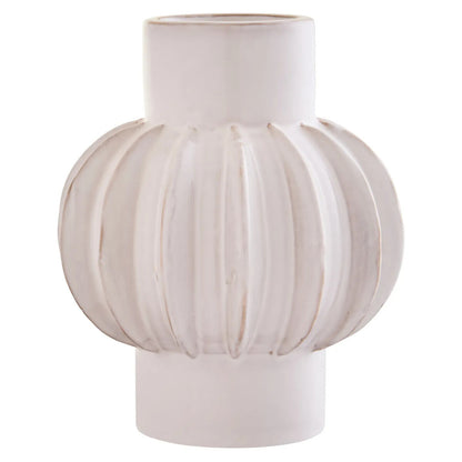 White ceramic vase with a unique, textured design on a white background