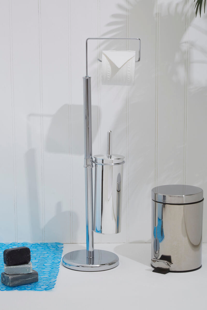 Bathroom cleaning tools including a toilet brush, holder, and trash can on a white surface with a tiled wall background.
