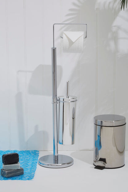 Bathroom cleaning tools including a toilet brush, holder, and trash can on a white surface with a tiled wall background.