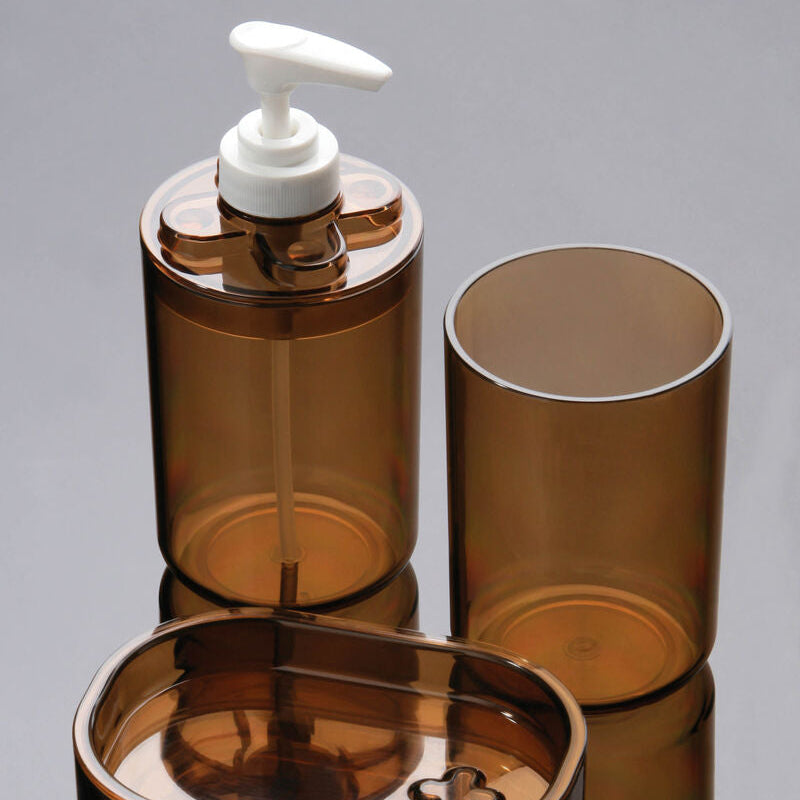 Brown bathroom accessory set with a pump dispenser on a gray background