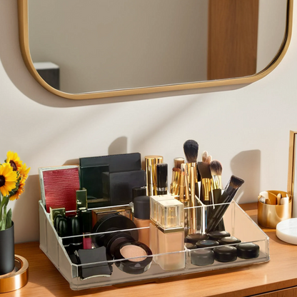 Makeup organizer on a vanity with various cosmetic items and a mirror in the background.