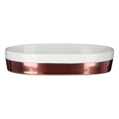 White oval dish with a copper rim on a white background