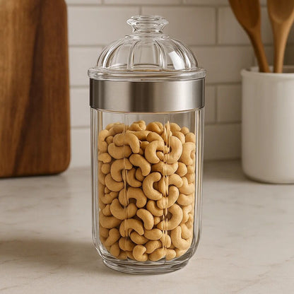 Glass jar with lid filled with cashews on a kitchen counter