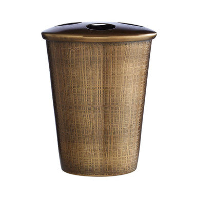 Wicker trash can with a black lid on a white background