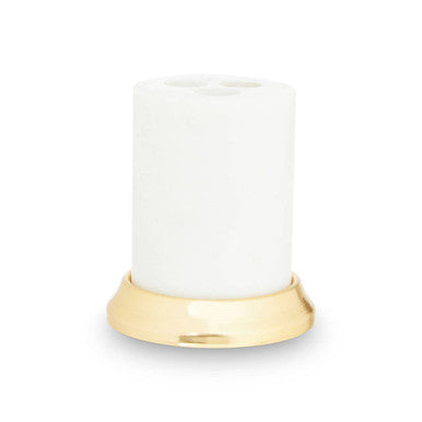 White candle with a gold base on a white background