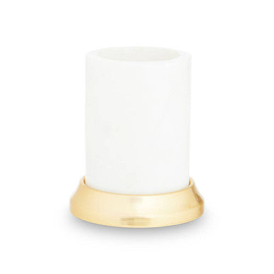 White candle with a gold base on a white background