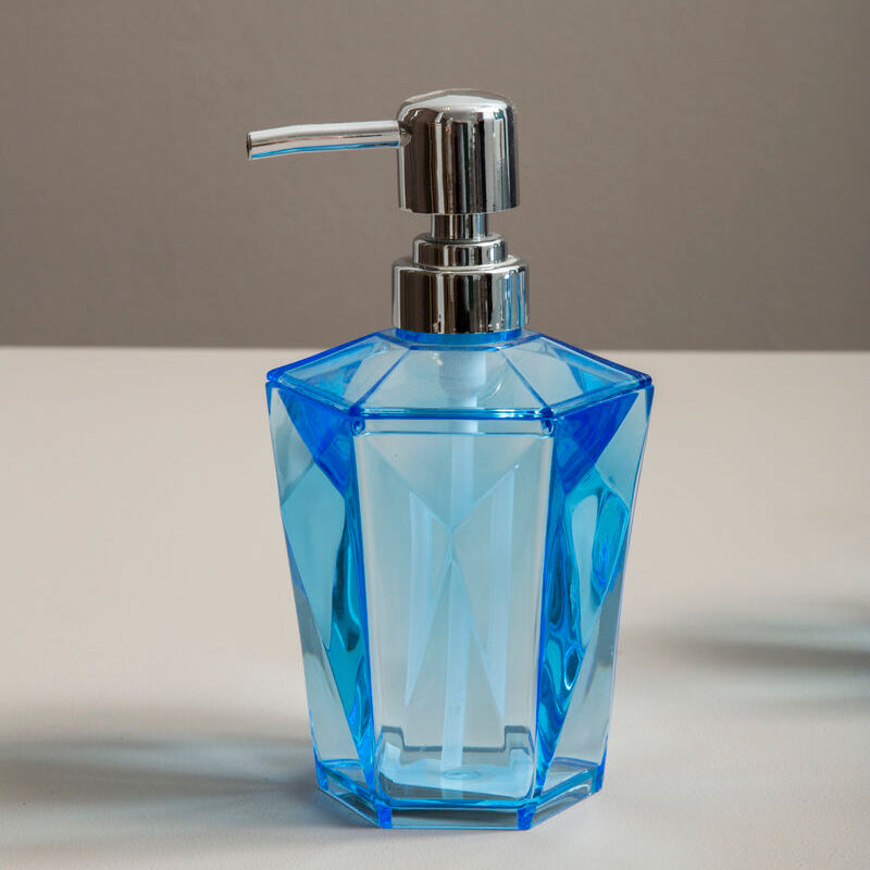 Blue glass soap dispenser with silver pump on a neutral background