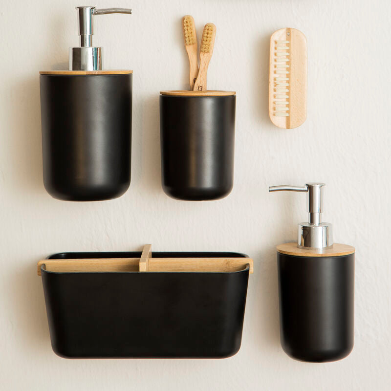 Set of black bathroom accessories with wooden accents on a light background