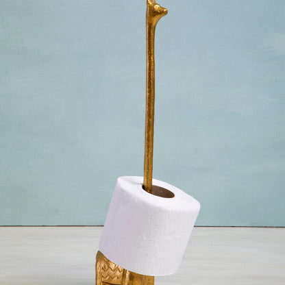Decorative object resembling a giraffe with a white base and gold accents on a light blue background