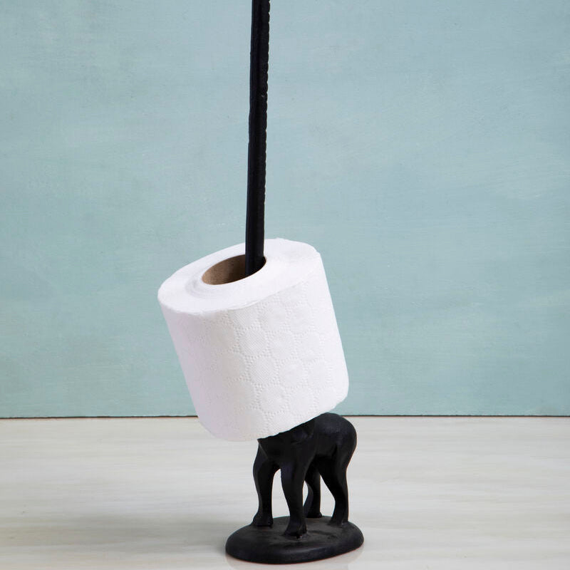 Black elephant-shaped toilet paper holder with a roll of toilet paper on a light blue background