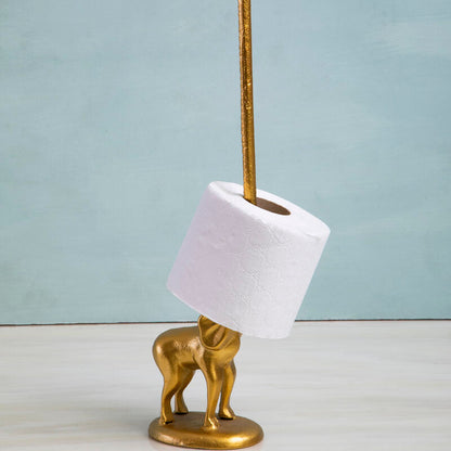 Brass elephant-shaped holder with a roll of toilet paper on a light blue background