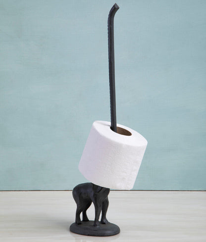 Black toilet brush holder with a roll of toilet paper on a light blue background