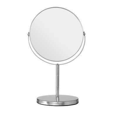 Silver stand-up makeup mirror on a white background