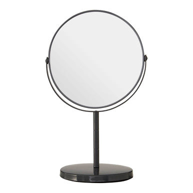 Round makeup mirror with black stand on a white background