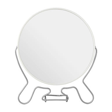 Round makeup mirror with metal stand on a white background