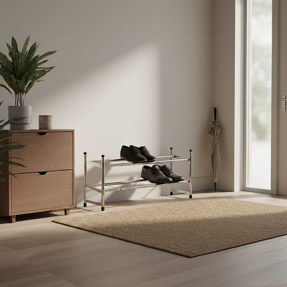 Shoe rack with shoes next to a wooden cabinet in a room with a large window.