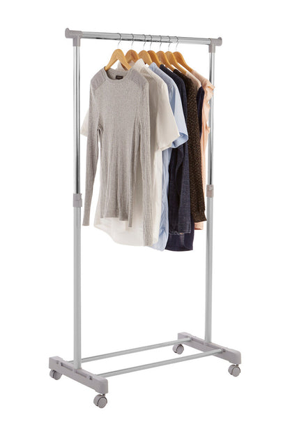 Clothing rack with clothes on a white background