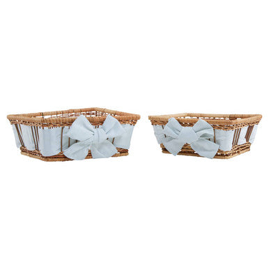 Two wicker baskets with white bows on a white background