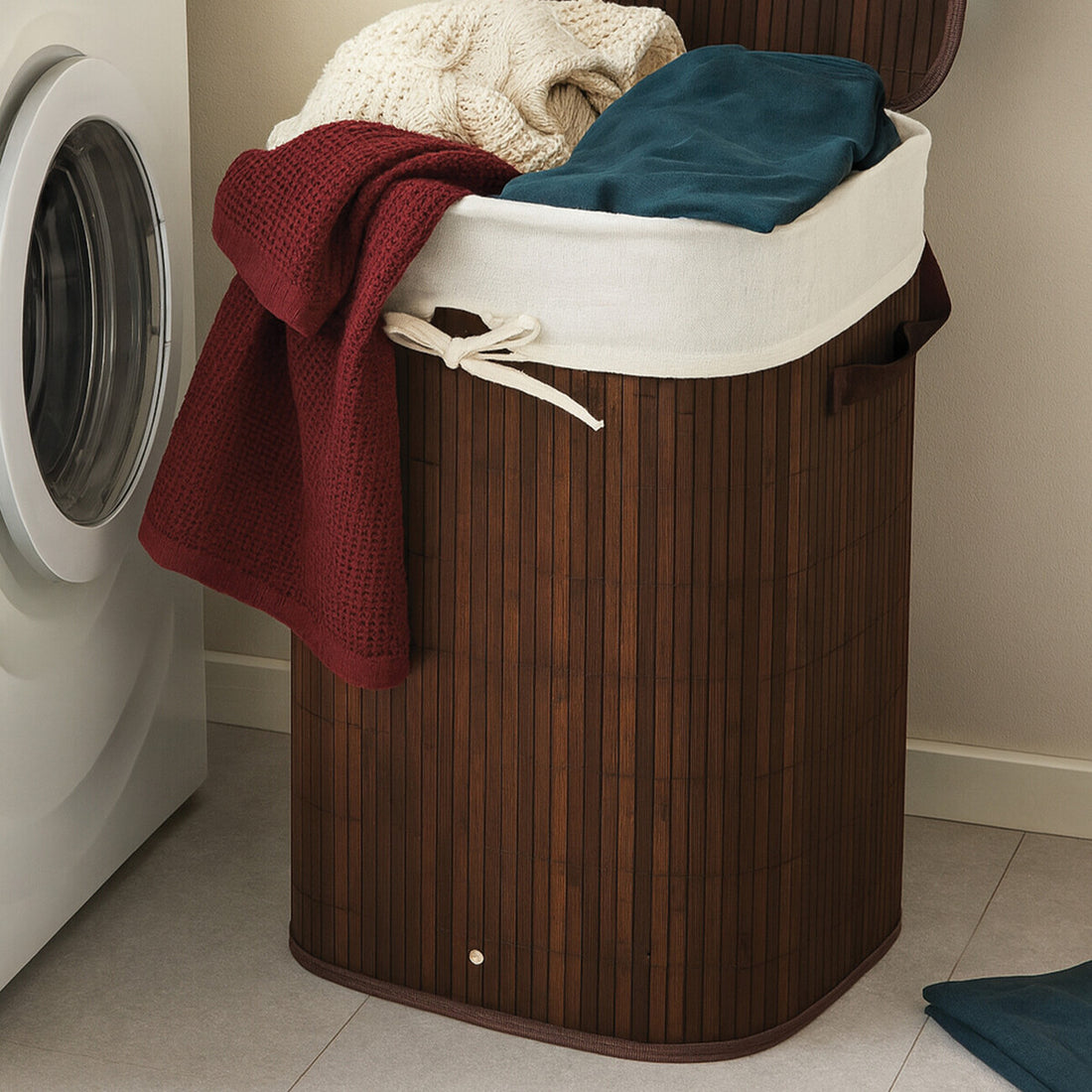 Wooden laundry basket with clothes next to a washing machine in a laundry room.