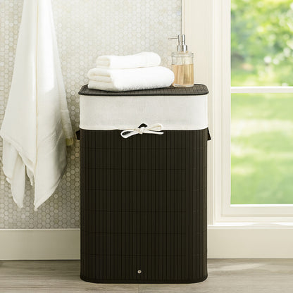 Black laundry basket with a white lid in a bathroom setting