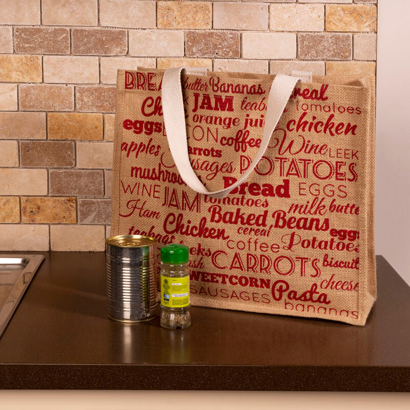Brown tote bag with red text on a kitchen counter