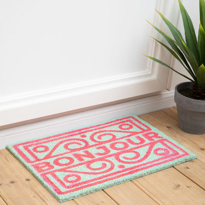 Pink and green doormat with &