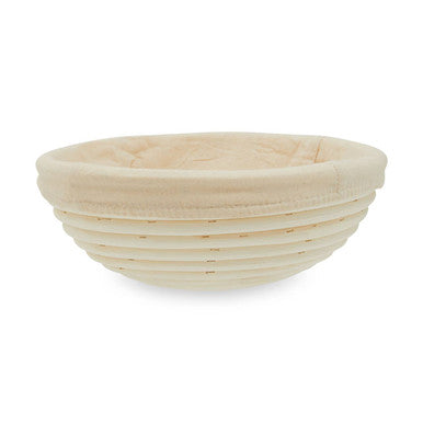 Rattan bread proofing basket on a white background