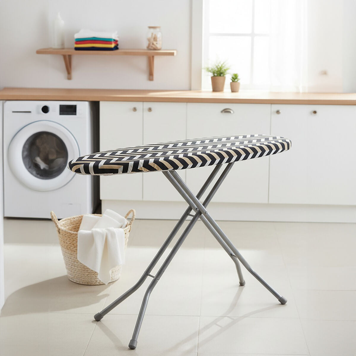 Black and white checkered ironing board in a laundry room with washing machine and shelves.