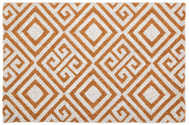 Patterned rug with orange and white geometric design
