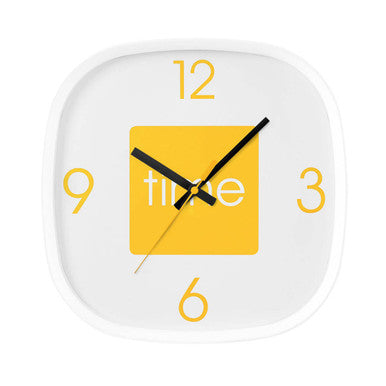 Square wall clock with yellow square face and black hour hands on a white background
