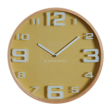 Yellow wall clock with wooden frame and white numbers on a white background