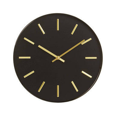 Black wall clock with gold hands on a white background