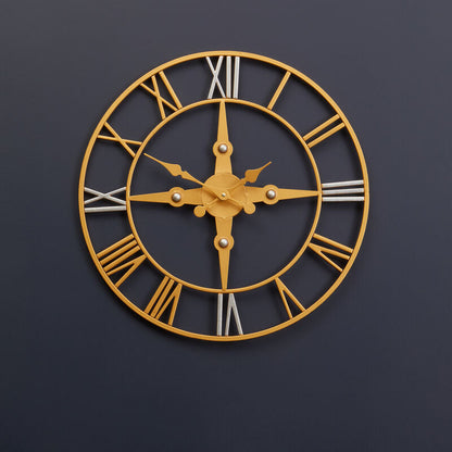 Gold wall clock with Roman numerals on a dark blue wall