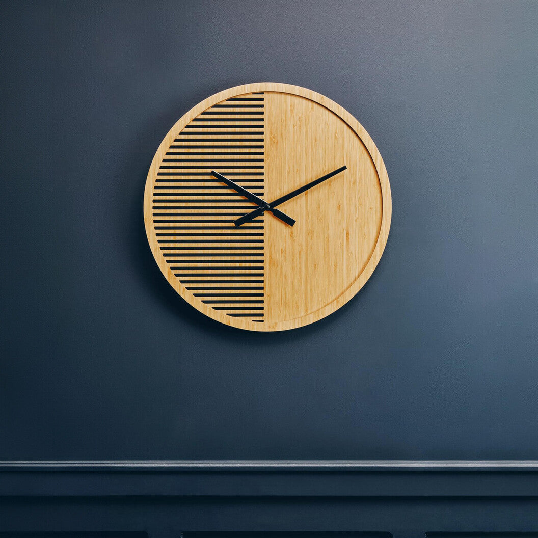 Wooden wall clock with black line design on a dark blue wall