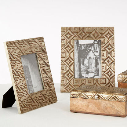 Decorative photo frames and wooden boxes with geometric patterns on a white background