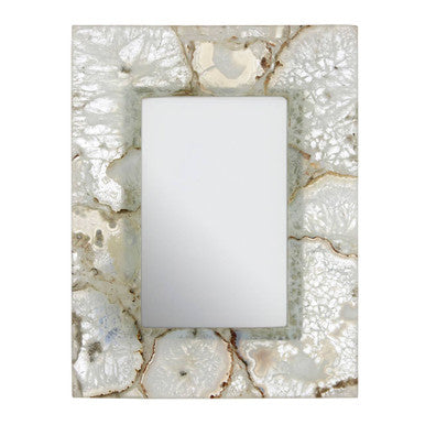 Decorative wall light fixture with a natural stone-like frame on a white background