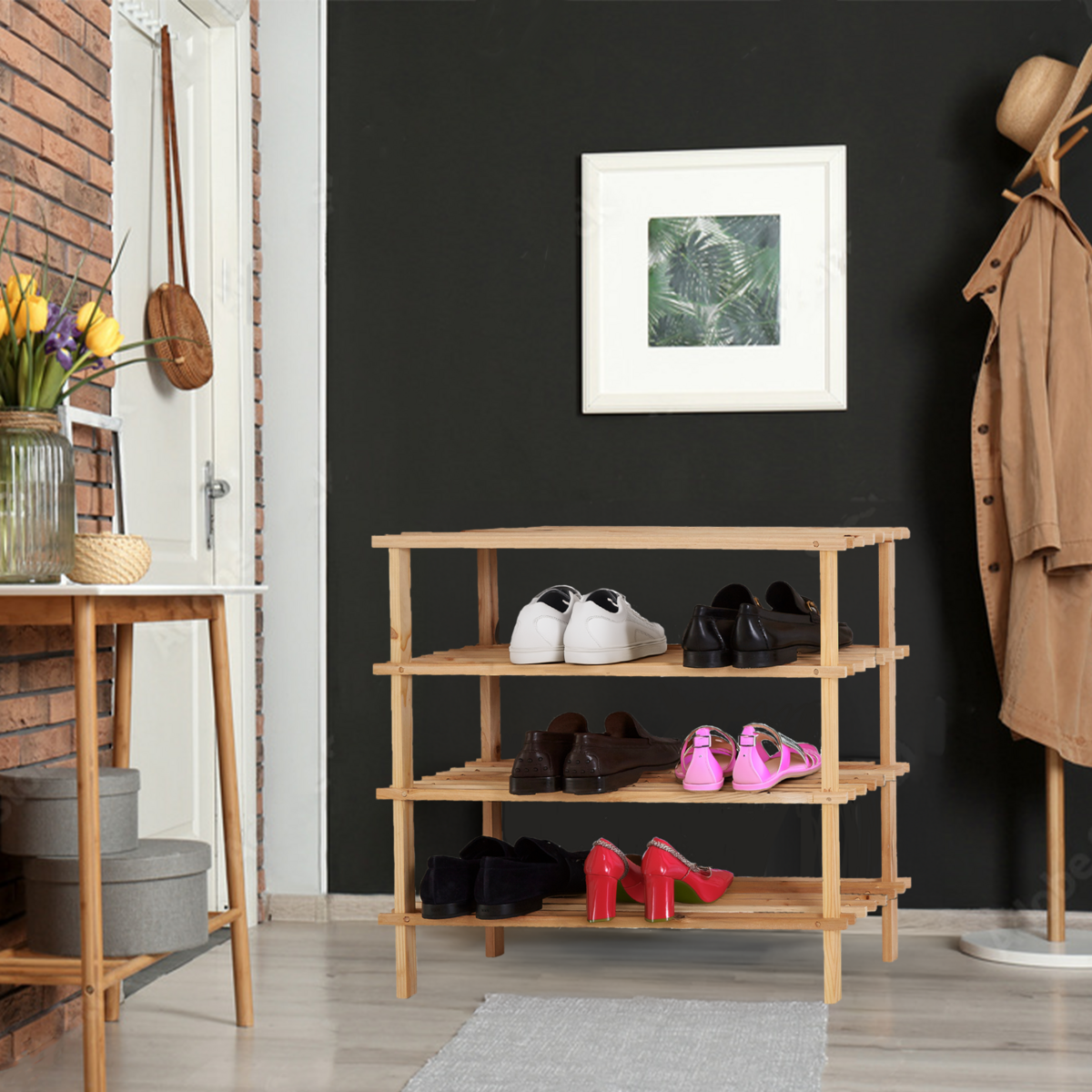 Wooden shoe rack with shoes against a black wall in a room with a coat rack and table.