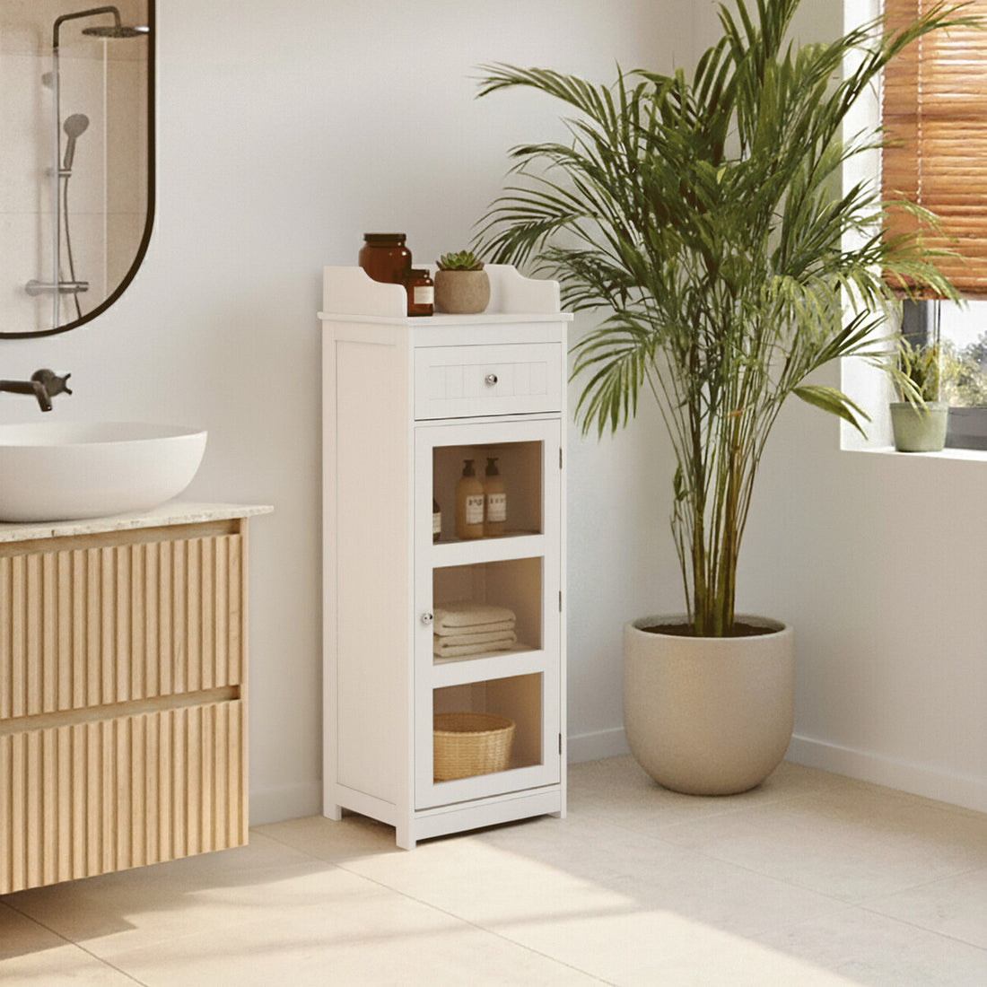 Bathroom with wooden vanity, white cabinet, and potted plant