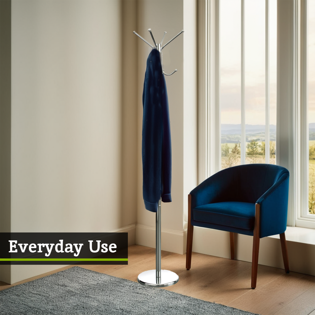 Hoodie on a stand next to a blue chair in a room with large windows.